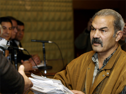 Labor activist Sayyed Habib handing in the petitions to the General Union officials, Photo by Mathew Carrington