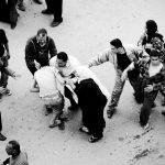 A Protestor is detained during clashes with riot police in Mahalla City about 110 km (68miles) north of Cairo, April 6, 2008