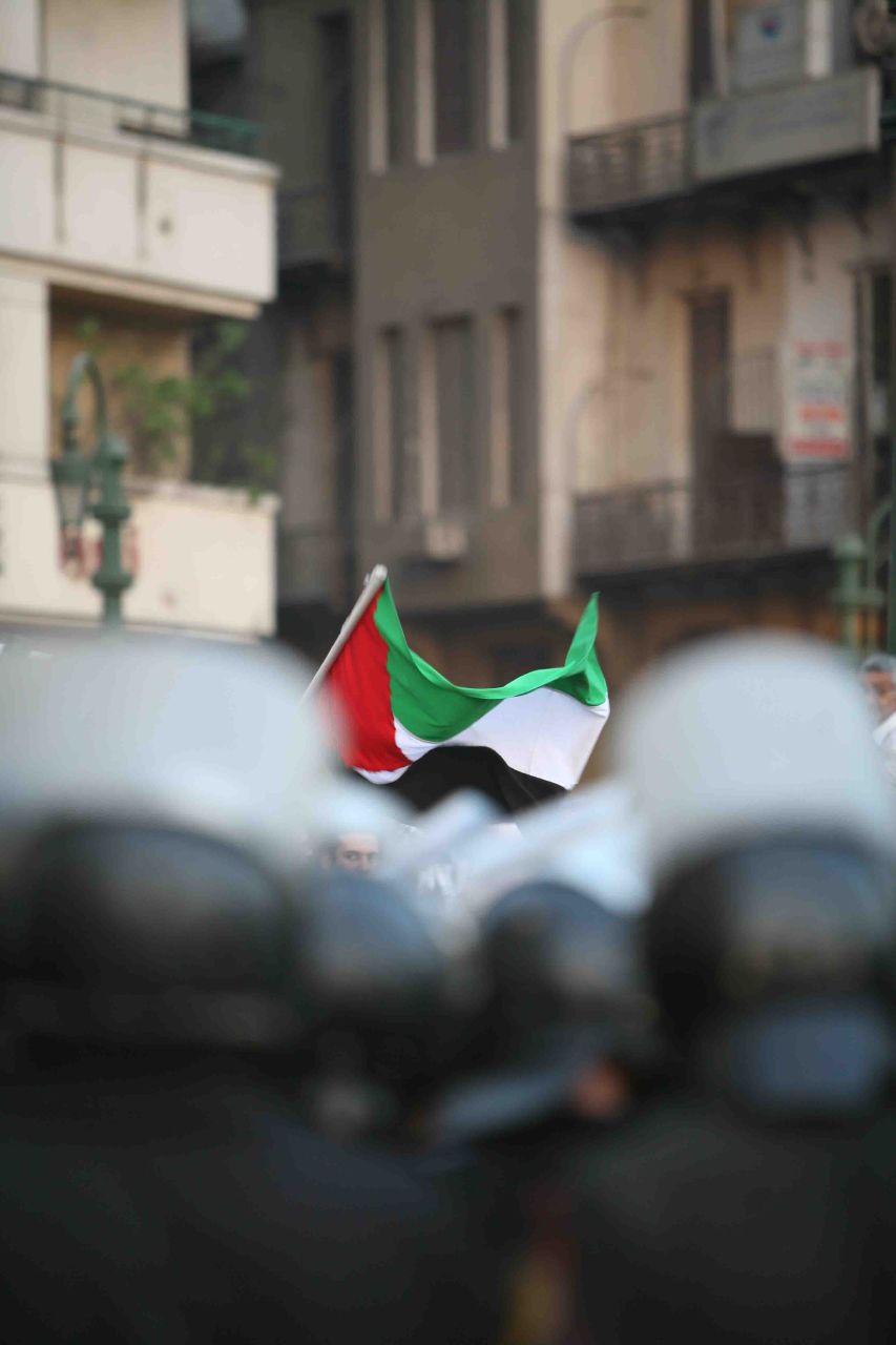Palestinian flag under siege by CSF troops in Tahrir Square (Photo by Amr Abdallah, 26 July 2006)