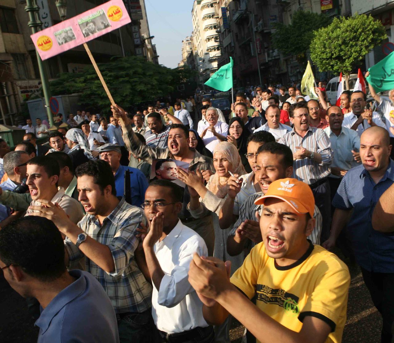 Kefaya activists march from the Nasserist Party HQ in Talaat Harb St, towards Tahrir Sq (Photo by Amr Abdallah, 26 July 2006)