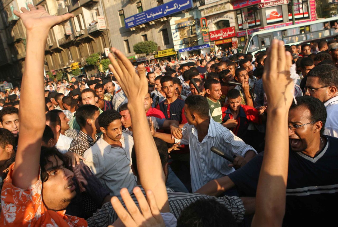 Baton-wielding thugs surround protesters in Tahrir Sq. (Photo by Amr Abdallah, 26 July 2006)