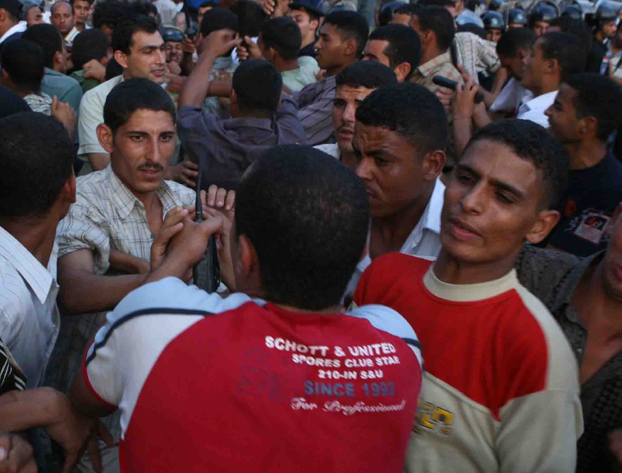 Plainclothes police thugs barring demonstrators from marching in Tahrir Square (Photo by Amr Abdallah, 26 July 2006)