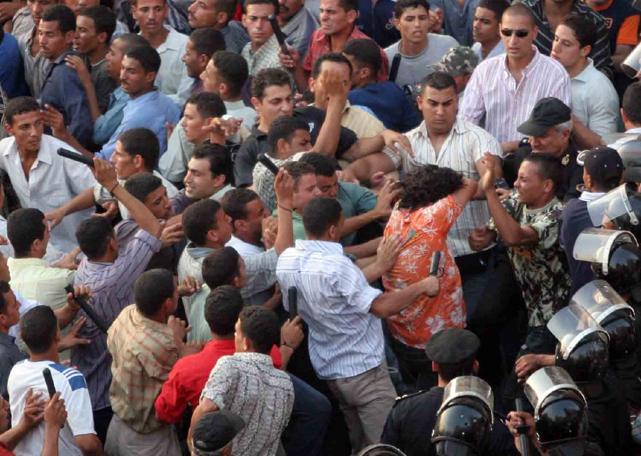 Plainclothes thugs attack protesters in Tahrir Square (Photo by Nasser Nouri, 26 July 2006)