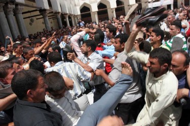 Police-deployed plainclothes thugs crack down on pro-Lebanese resistance demonstrators, at Al-Azhar Mosque, 11 August 2006. Photo by Nasser Nouri