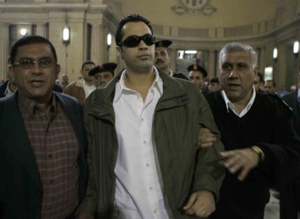 Police Captain Islam Nabih on his way to the courtroom. Photo by Nasser Nouri.